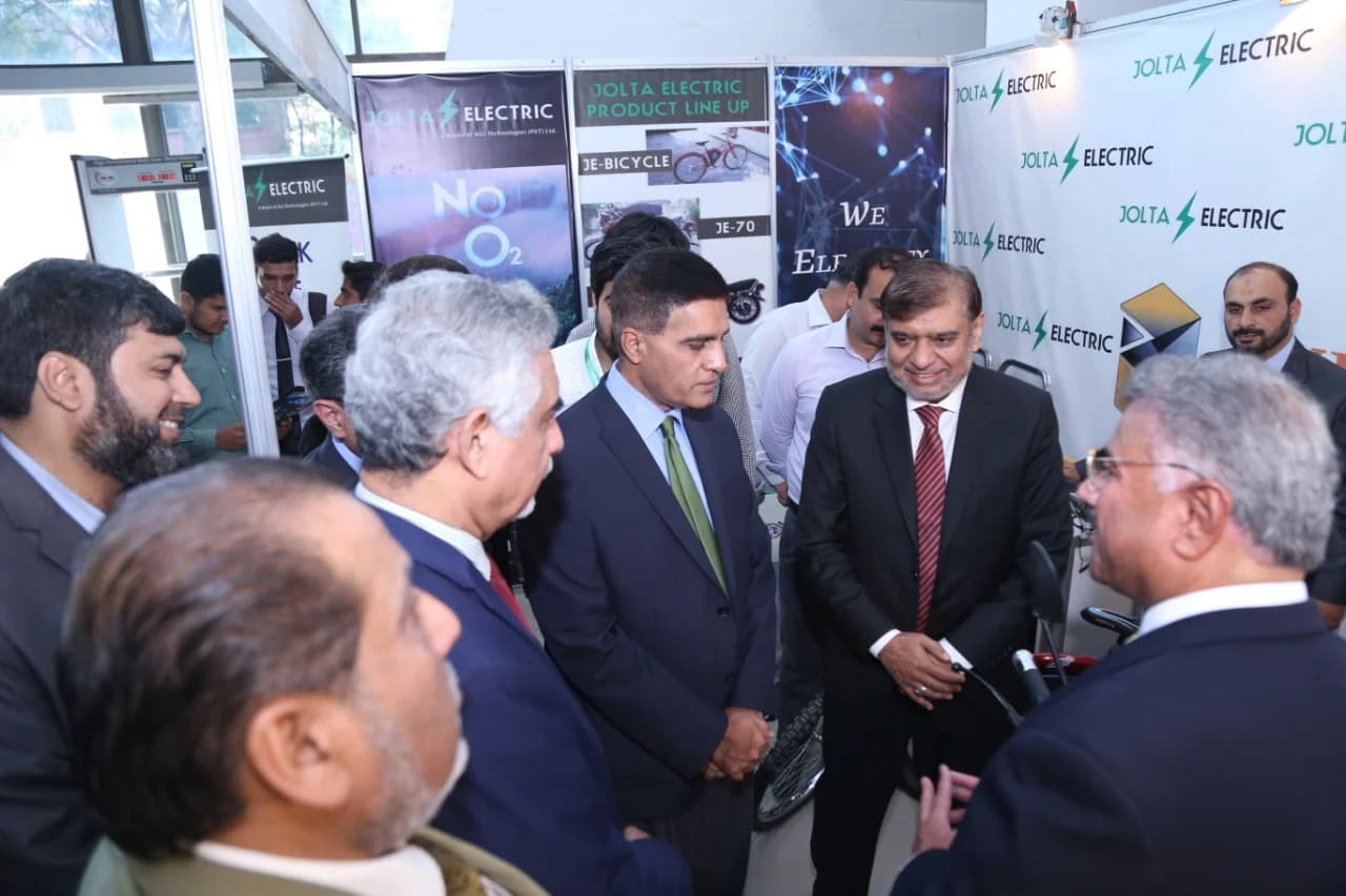 Briefing academic leaders at the Jolta Electric display