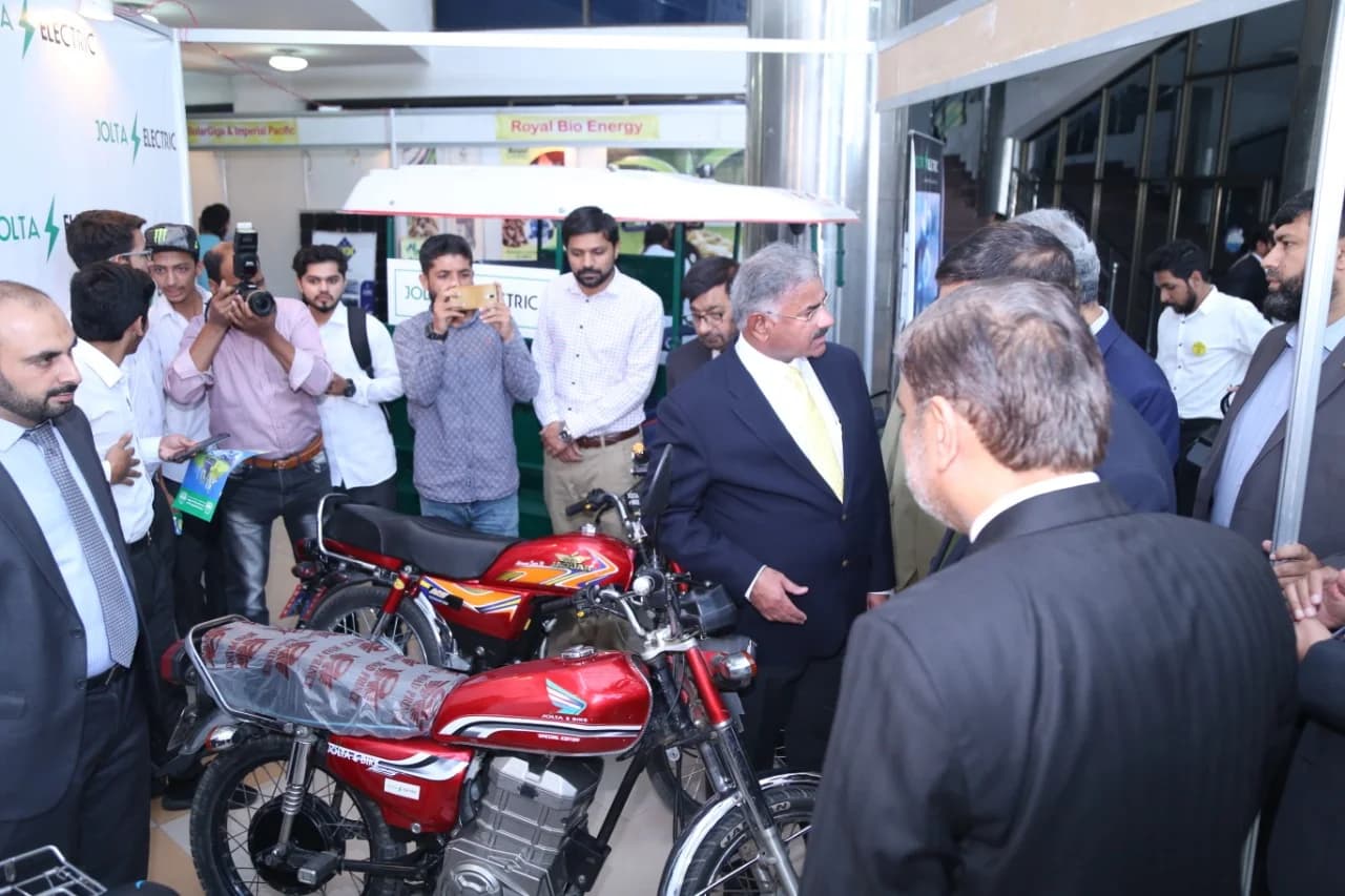 The Chairman HEC Punjab and Vice Chancellor UET Lahore viewing Jolta Electric's converted electric motorcycle