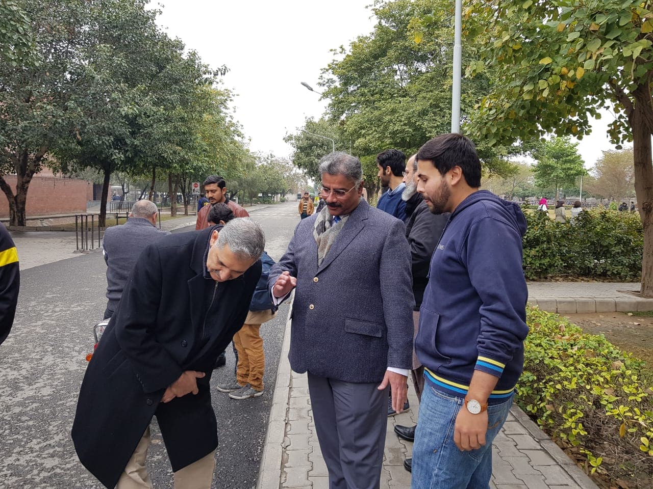 Irfan Ahmed discussing electric mobility policy with LUMS professors